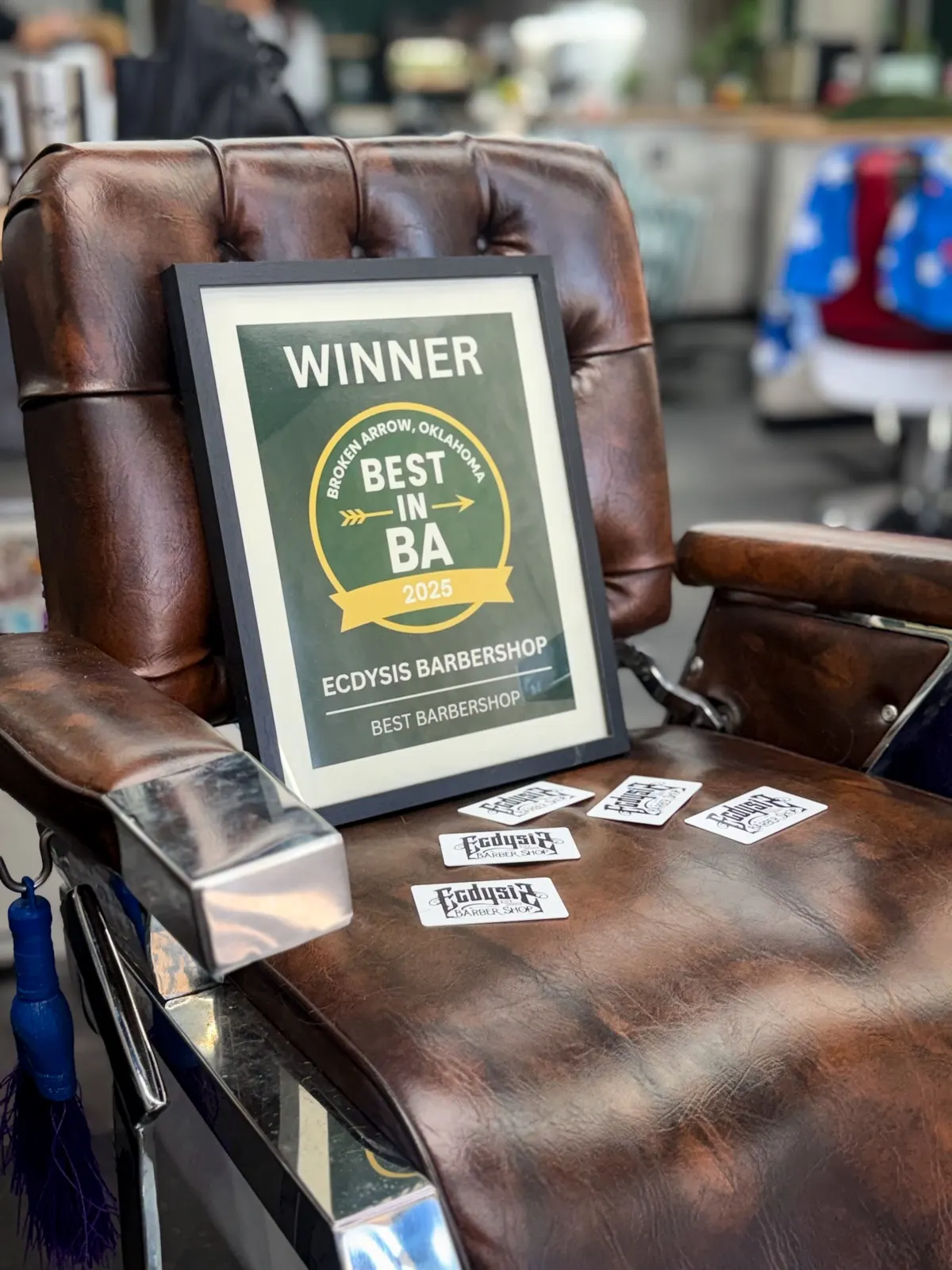 Best in BA certificate on a barber chair at Ecdysis Barbershop