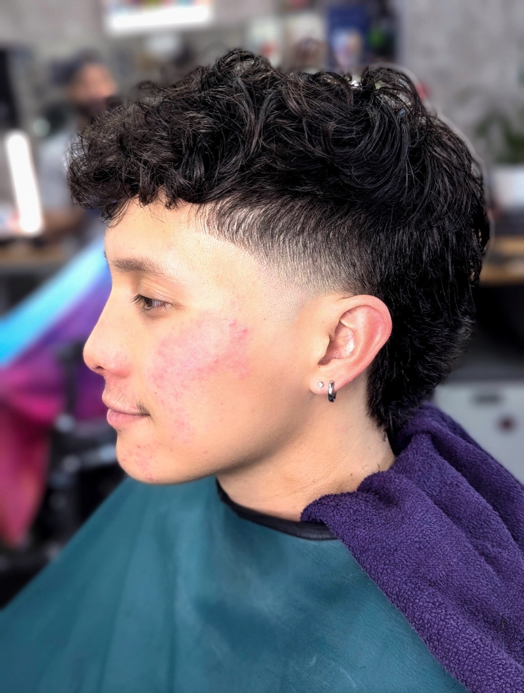 Curly top with a taper fade